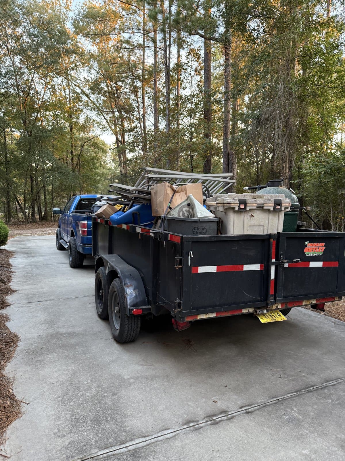 Loaded junk removal trailer ready for haul