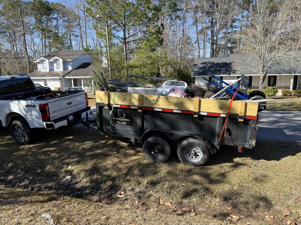 Truck and trailer loaded with debris
